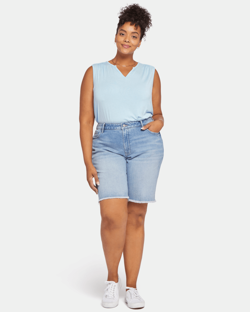 Front of a model wearing a size 14W Keira Boyfriend Shorts in Quinta by NYDJ. | dia_product_style_image_id:200899